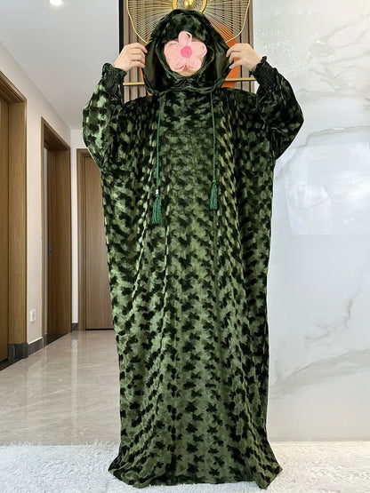 Elegant Islamic prayer kaftan dress in rich velvet material, designed for sophisticated modest fashion.
