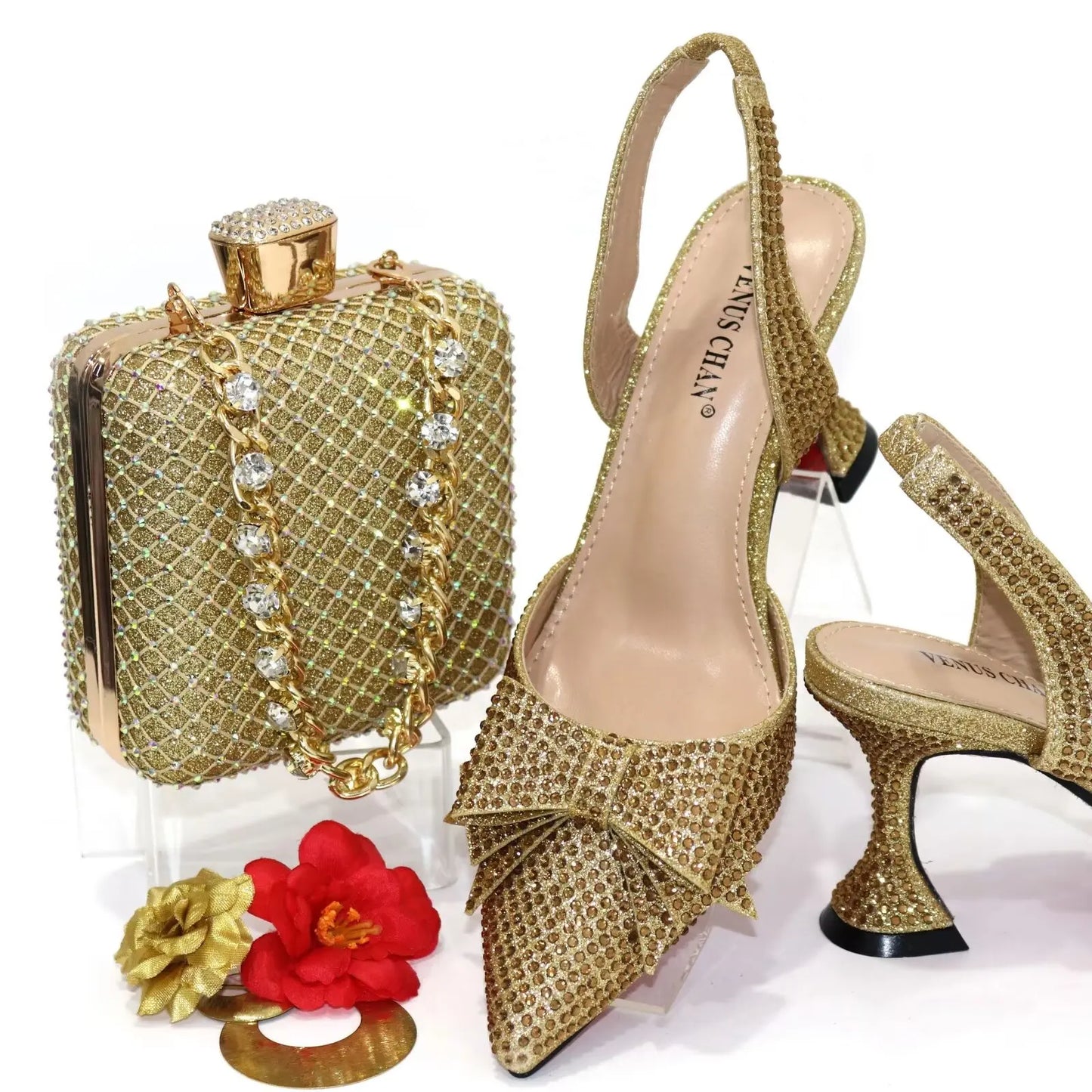 Elegant gold ladies' pointed toe pumps with exquisite crystal details, perfect for formal occasions.