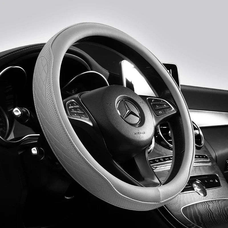 Luxury Napa leather perforated patchwork steering wheel cover in a sophisticated design, enhancing grip and comfort.