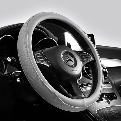 Luxury Napa leather perforated patchwork steering wheel cover in a sophisticated design, enhancing grip and comfort.