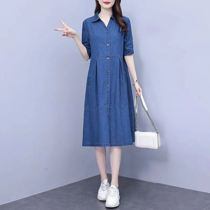 Stylish overhead view of the oversized 5XL denim dress with short sleeves, emphasising its sleek pockets and refined A-line shape, perfect for modern women seeking comfort and elegance.