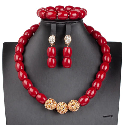 Complete luxury African beads jewelry set showcasing statement necklace, earrings, and bracelet with artificial coral.