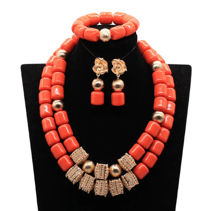 Luxury African beads jewellery set featuring a statement necklace, elegant earrings, and a matching bracelet adorned with artificial coral for a classic look.