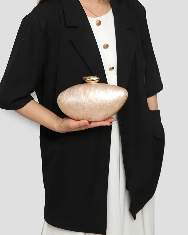 Trendy clutch purse with chain strap in stunning acrylic, ideal for stylish evening events.