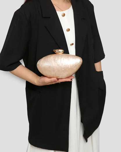 Trendy clutch purse with chain strap in stunning acrylic, ideal for stylish evening events.