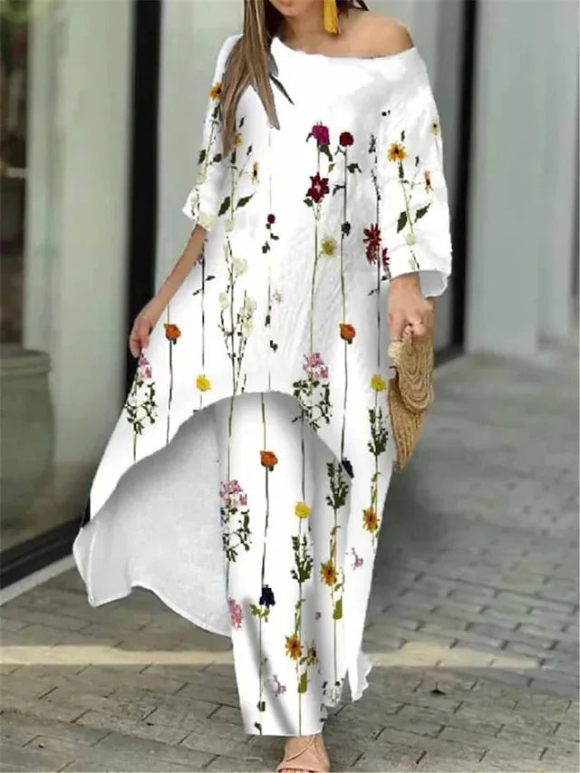 Detail shot of the asymmetrical neckline and full-length sleeves of the luxury women's shirt from the two-piece set, designed for a unique and fashionable look this spring/summer.