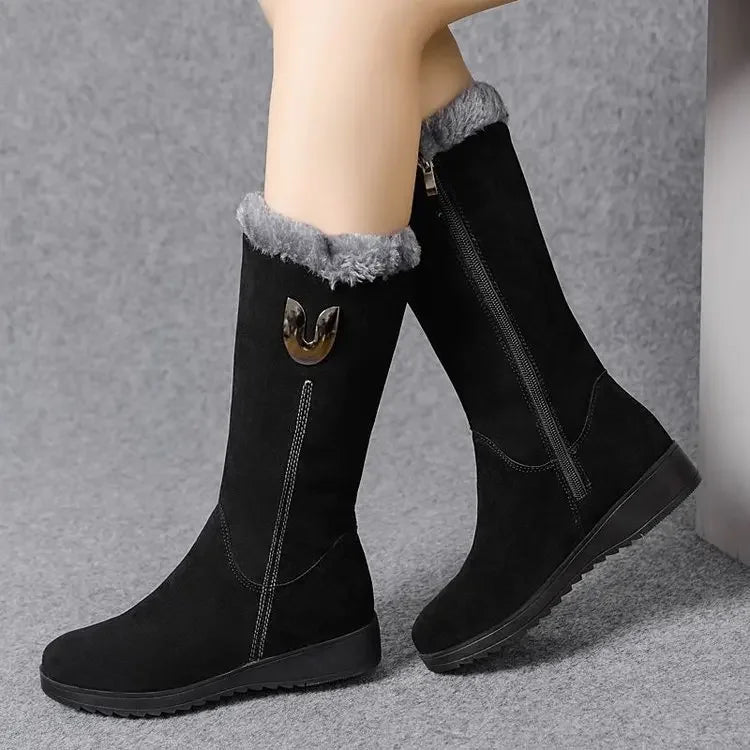 Sumptuous mid-calf winter boots featuring a plush lining and modern design, ideal for women seeking warmth and style in cold weather.