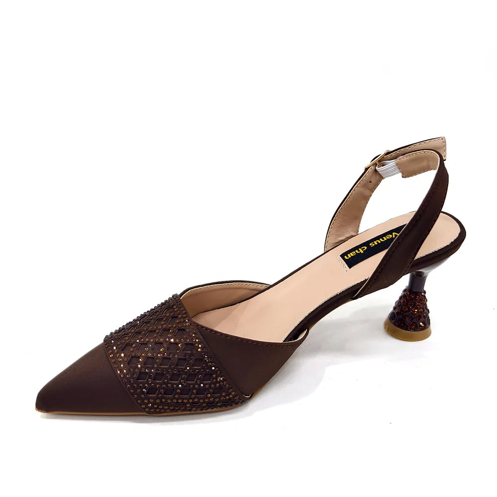 Close-up of luxurious wine colour heeled shoes featuring a pointed toe and spike heels, ideal for elegant parties and wedding celebrations.