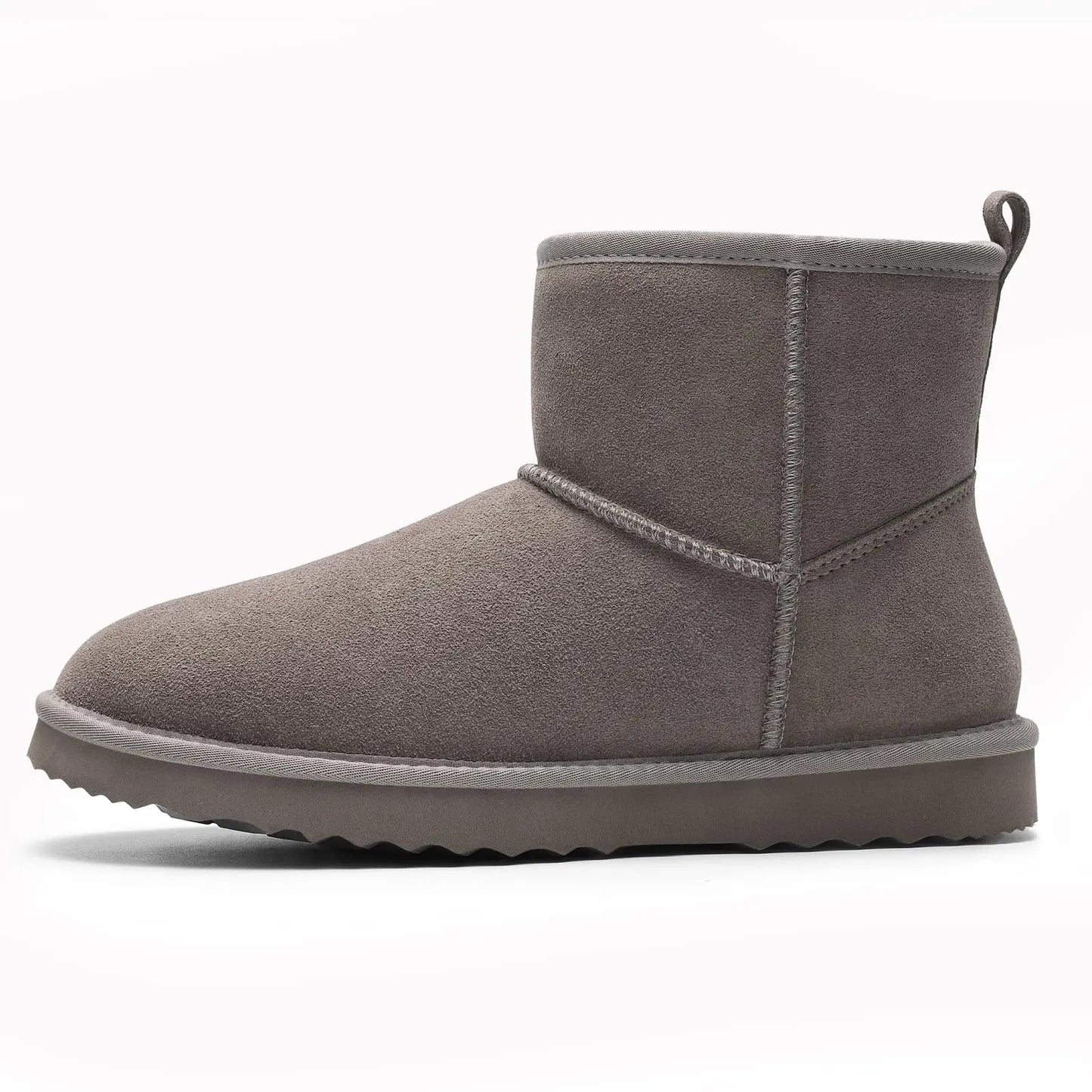 Chic close-up view of women's suede ankle snow boots showcasing soft plush lining, ideal for comfort and style.