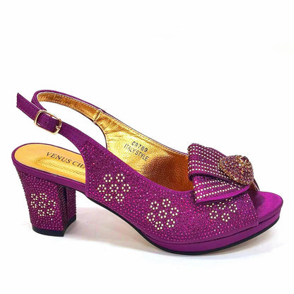 Stylish close-up of Venus Chan golden wedding shoes showcasing intricate diamond details and high spike heels, perfect for brides and special events.