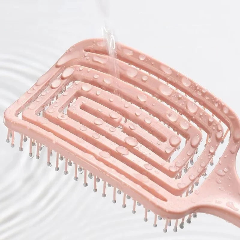 Elegant Elastic Hollow Out Massage Comb, perfect for hair styling and detangling with luxurious scalp massage experience.