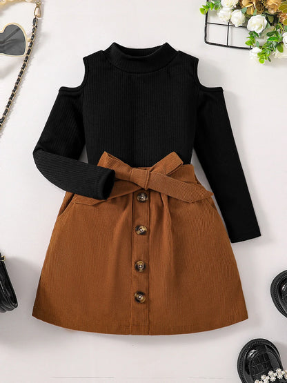 Close-up of the luxurious fabric and craftsmanship of the girls' off-shoulder turtleneck top, part of an autumn fashion set for ages 4-6.