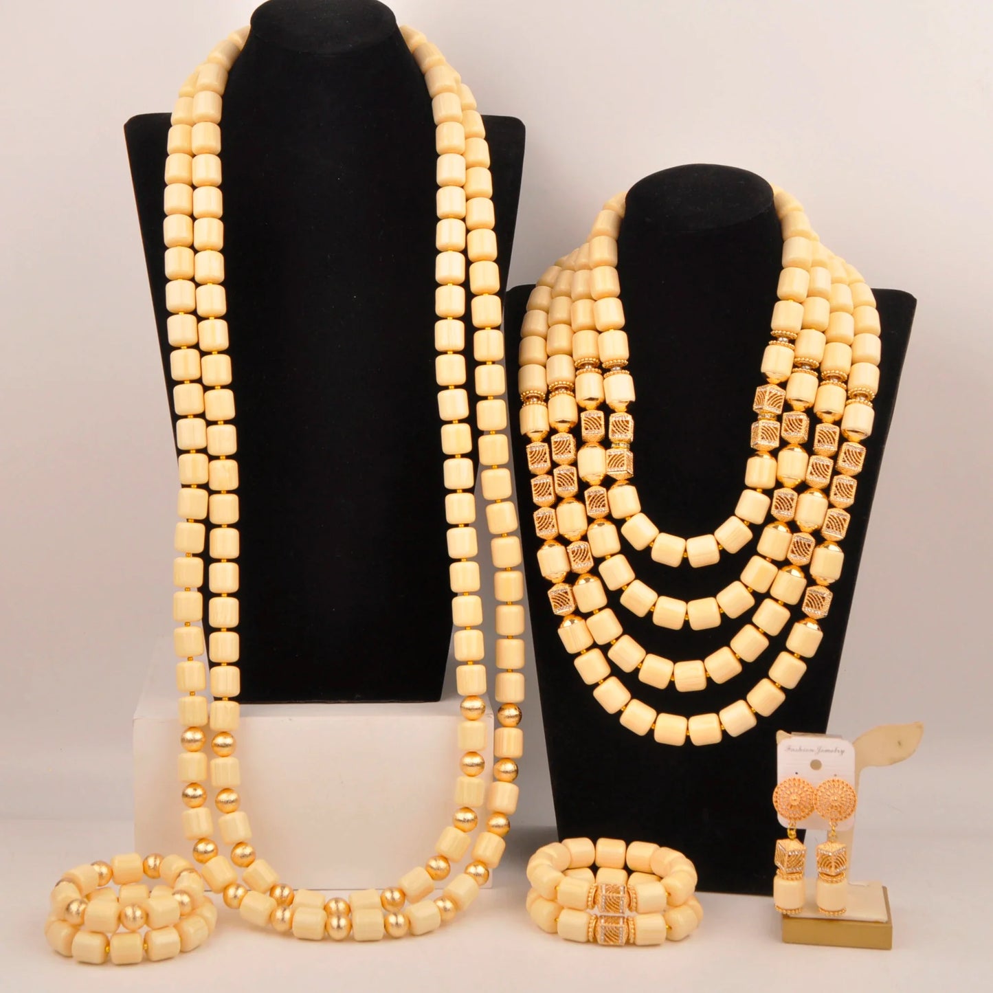 Complete Nigerian bridal jewelry set displayed elegantly, including a necklace, bracelet, and earrings made with fine artificial coral beads, adding charm to bridal looks.