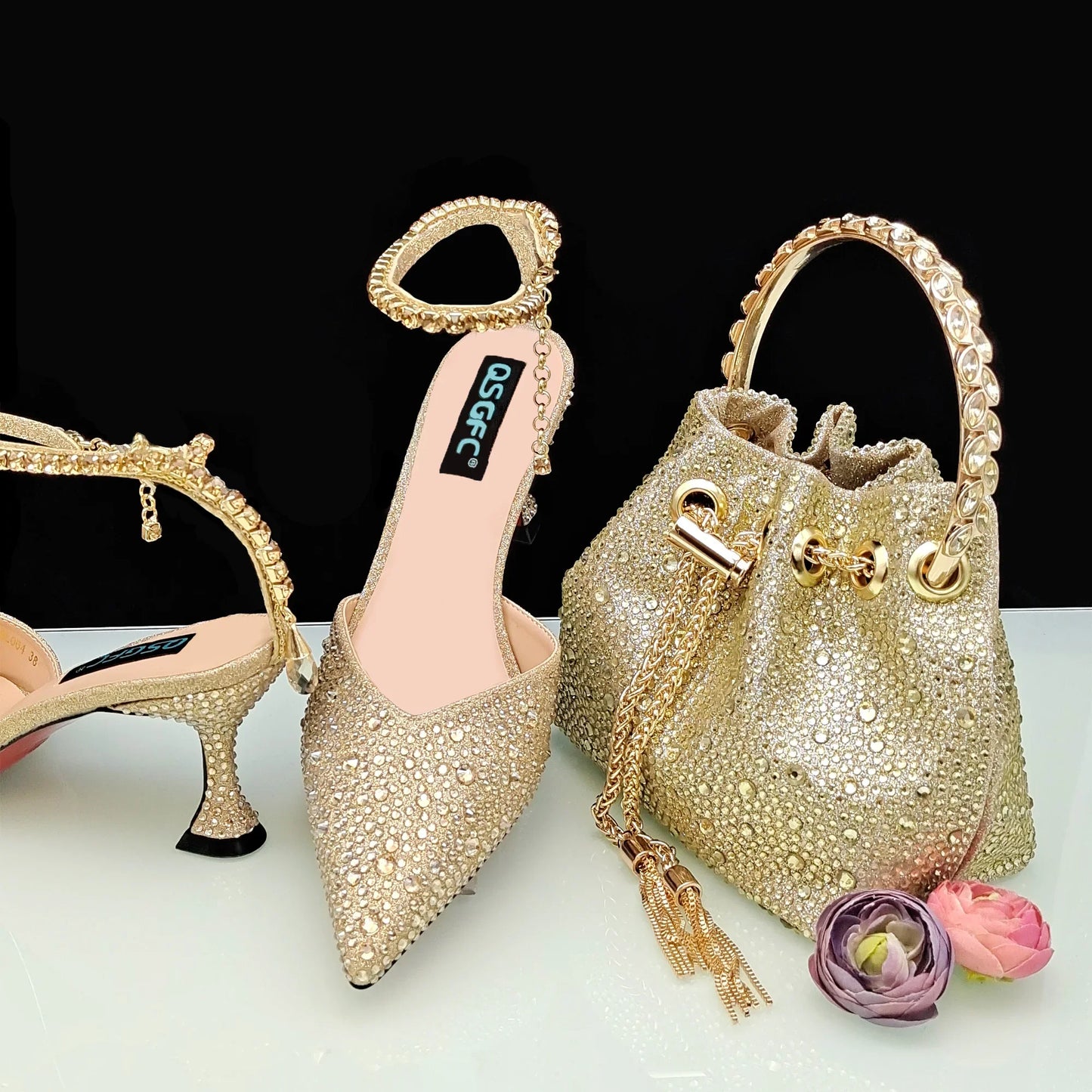 Close-up of luxurious gold glitter high heels with sparkling rhinestone details, designed for sophisticated women, ideal for special occasions.