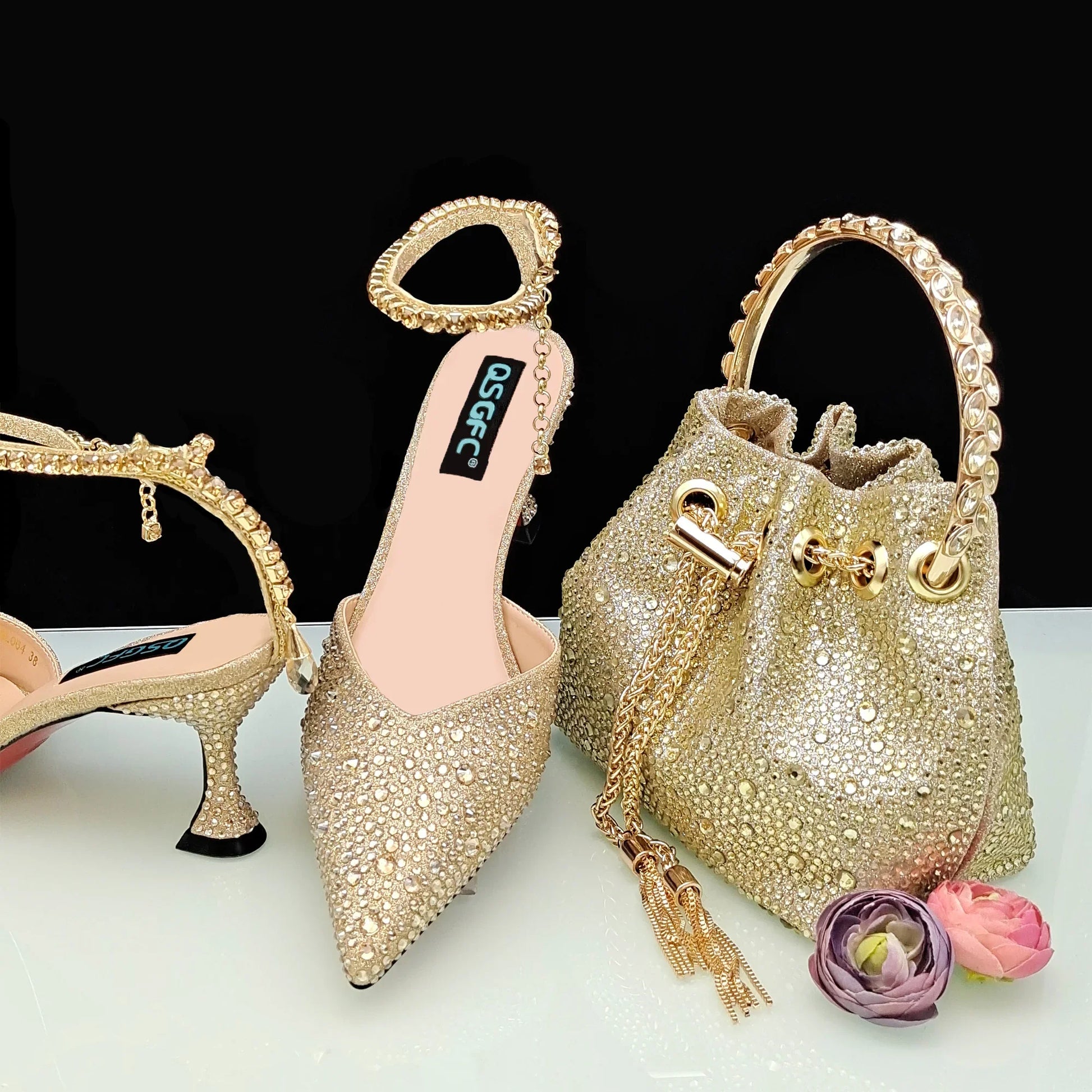 Close-up of luxurious gold glitter high heels with sparkling rhinestone details, designed for sophisticated women, ideal for special occasions.