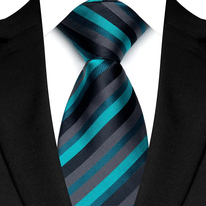 Elegant classic men's neck tie showcasing a striped pattern in vibrant green and blue hues, perfect for formal occasions.