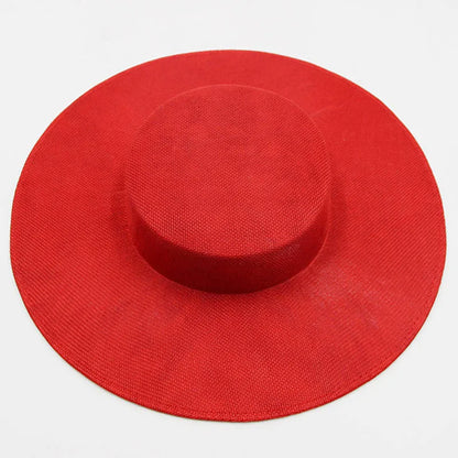 Elegant ladies wide brim sinamay fascinator hat in rich burgundy, perfect for weddings and parties, displaying exquisite craftsmanship and luxury style.