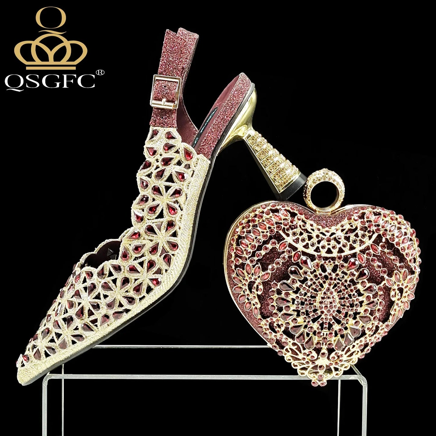 Stylish matching fuchsia handbag with long chain shoulder strap, complementing the QSGFC heel pumps.