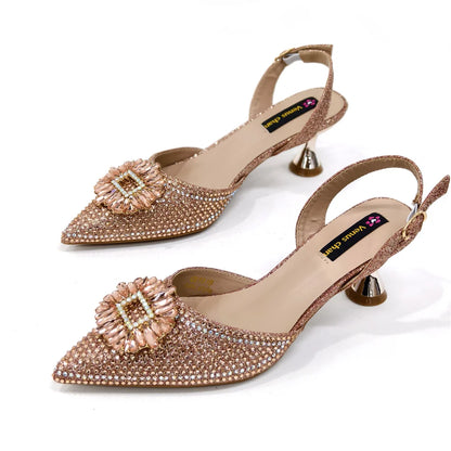 Matching handbag set with metal handle, beautifully crafted to complement elegant women's party shoes.