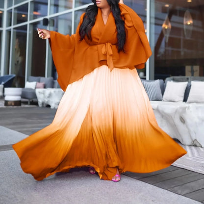 CM.YAYA Women's luxurious autumn/winter gradient blouse and pleated long skirt set, showcasing a high street fashion style with batwing sleeves.