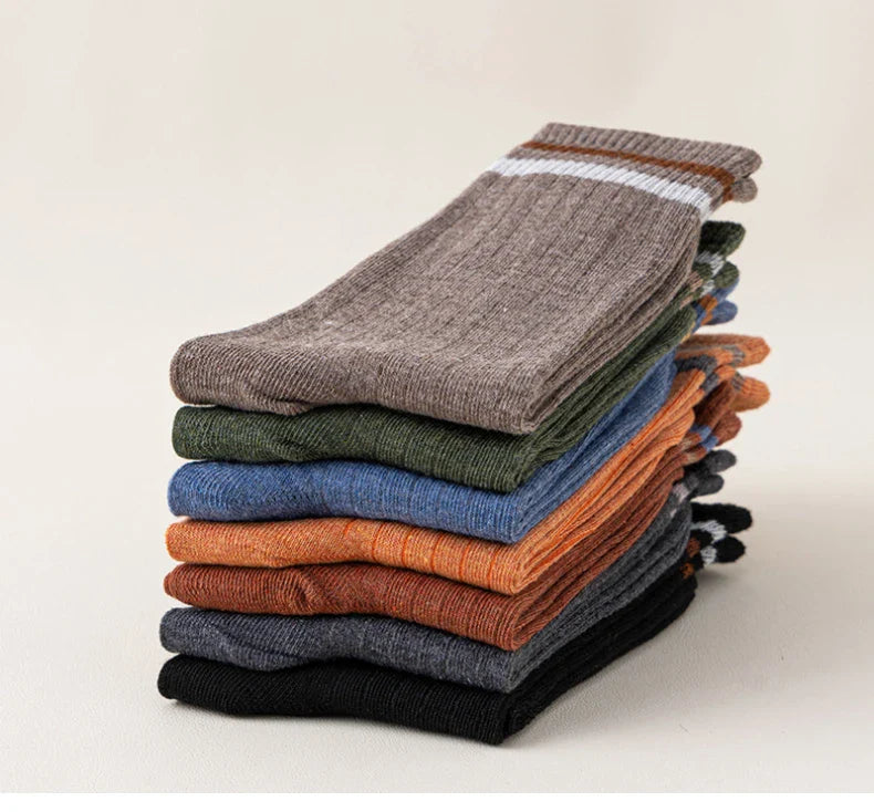 Chic and practical men's crew socks for winter sports, featuring five pairs crafted from luxurious materials designed to deliver warmth, comfort, and style during the colder months.