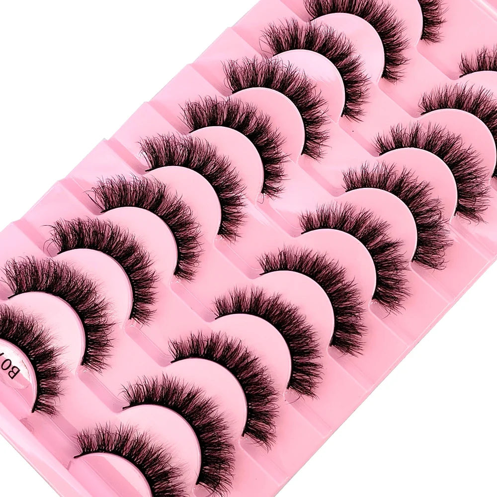 Elegant display of multiple pairs of luxurious 3D faux mink lashes, featuring a blend of dramatic and natural styles for versatile beauty applications.