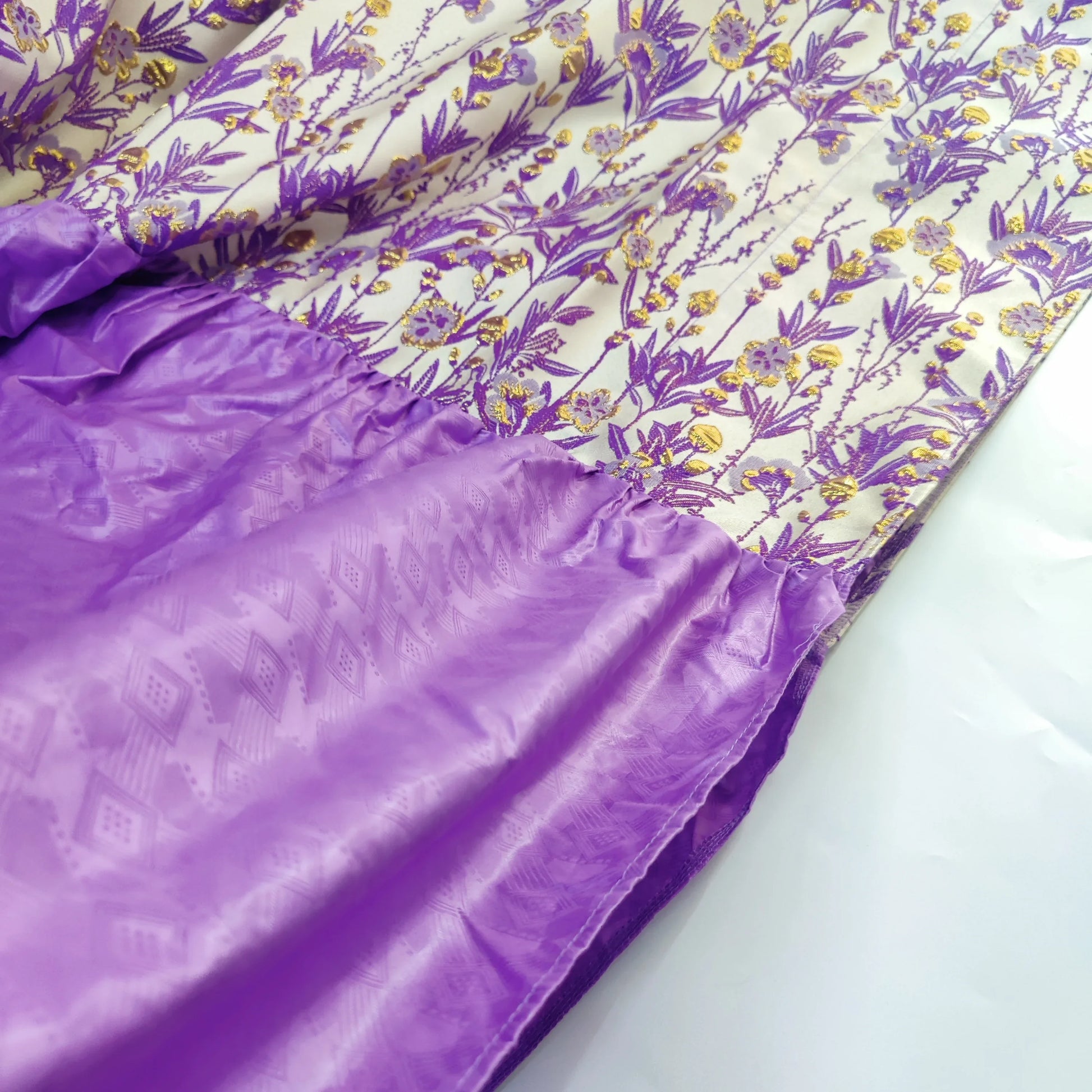 Stylish luxury African boubou dress in lake blue, exhibiting exquisite craftsmanship and unique fabric design, suitable for formal events.