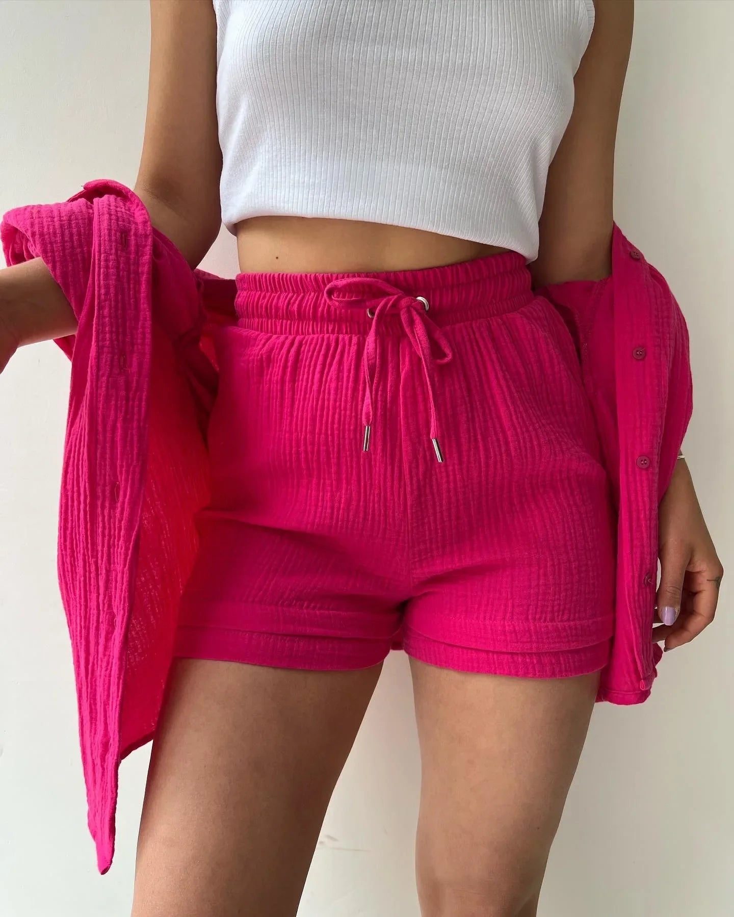 Stylish view of drawstring wide-leg shorts, part of the women's luxury grass green two-piece set, combining comfort with chic summer fashion.