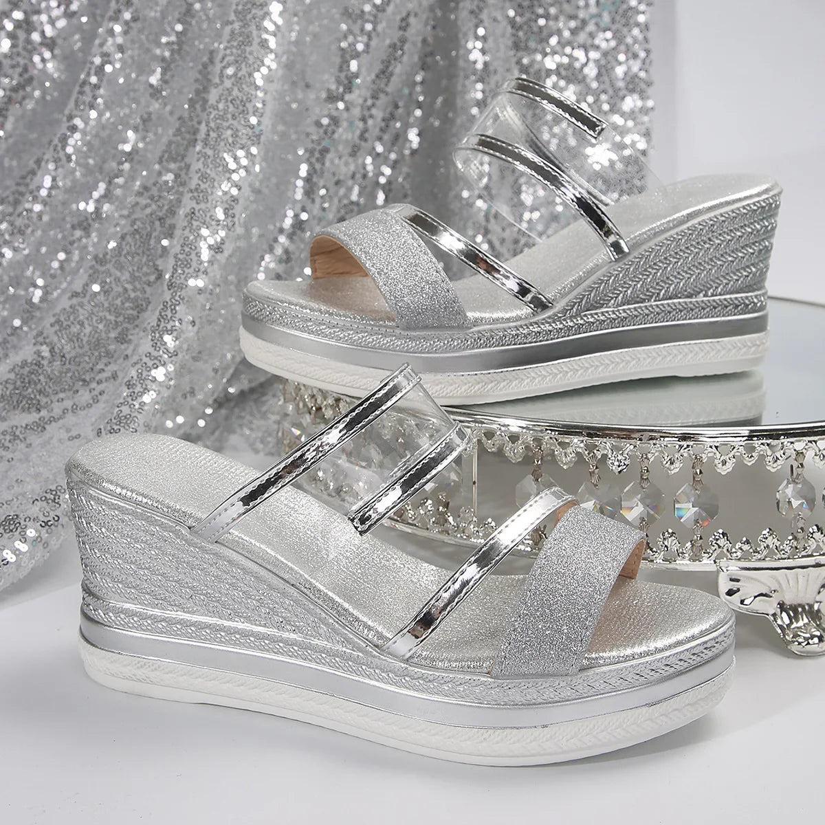 Beautifully crafted luxury wedge sandals featuring a slip-on closure and high heel design, perfect accessory for evening wear.