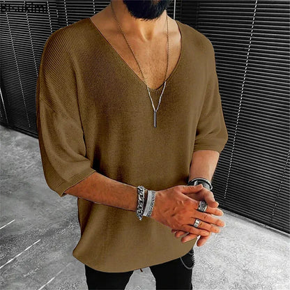 Luxurious short-sleeve V-neck men's knit top in black, designed for easy pairing and enhanced breathability, perfect for upscale casual wear.