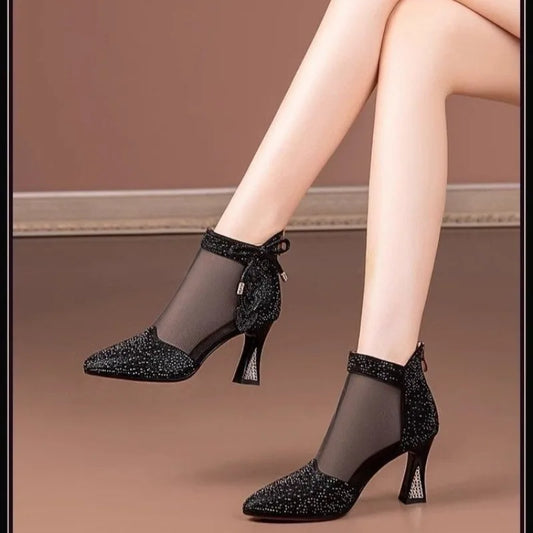 Luxury elegant rhinestone-embellished high heel ankle boots for women, featuring breathable PU material and a pointed toe design.