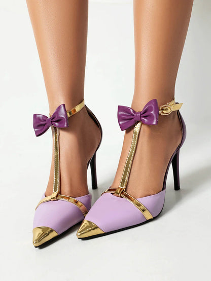 Side view of stylish high heels featuring a pointed toe and thin heel in a luxurious gold and purple colour scheme.