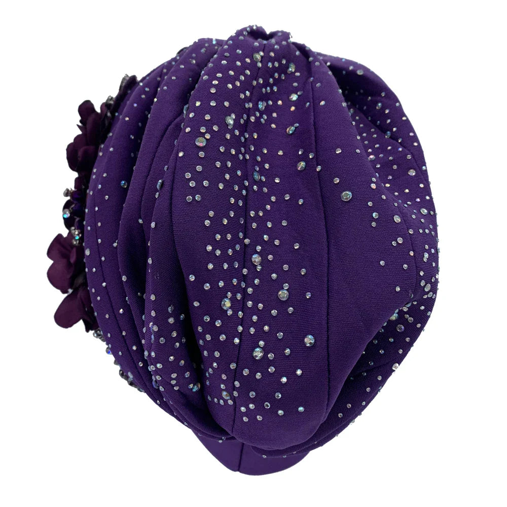 Stylish women's head wrap featuring a beautiful African-inspired turban design with shiny rhinestones, perfect for adding flair to any outfit.