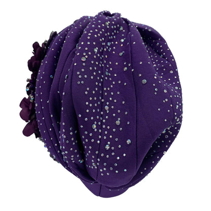 Stylish women's head wrap featuring a beautiful African-inspired turban design with shiny rhinestones, perfect for adding flair to any outfit.