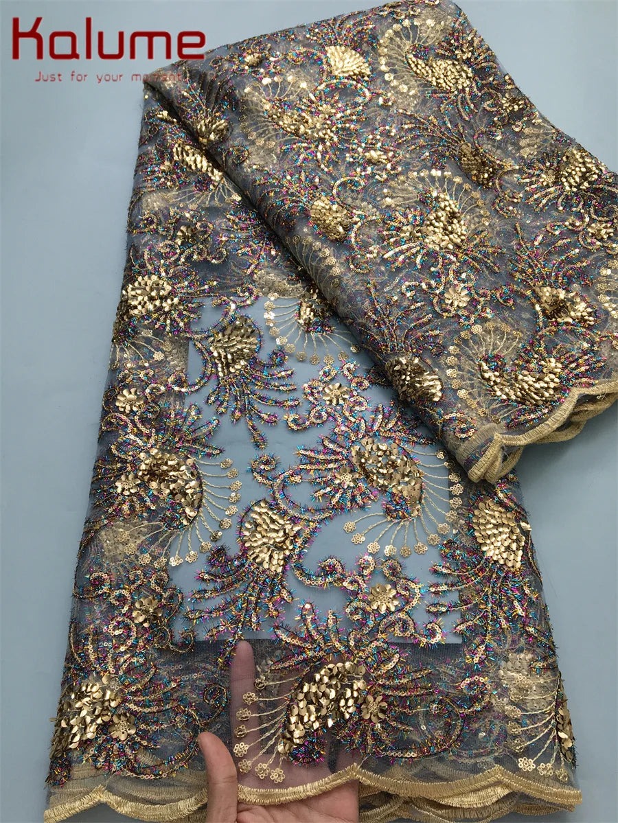 Kalume High-Quality African Lace Fabric in a sophisticated setting, ideal for bespoke wedding dresses and formal wear, featuring a lavish mesh design.