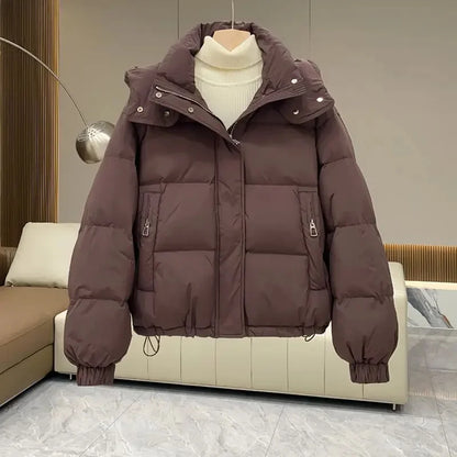 Luxurious women's hooded padded parka jacket in rich cotton and polyester blend, perfect for Autumn/Winter streetwear with an elegant design and timeless appeal.