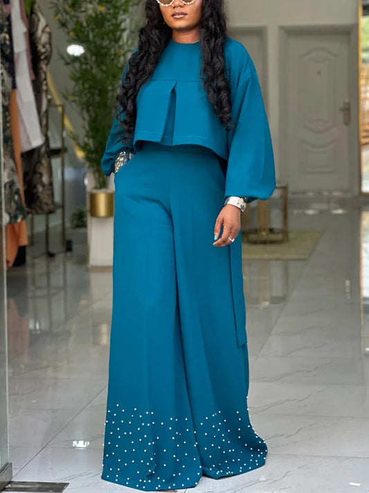 Luxurious high-waisted wide-leg trousers from the elegant 2-piece women's outfit set, complemented by an embroidered lantern sleeve top, ideal for modern office and evening occasions.