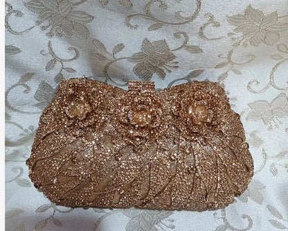 Stylish solid design minaudiere clutch bag for women, showcasing exquisite rhinestone detailing for a glamorous touch.