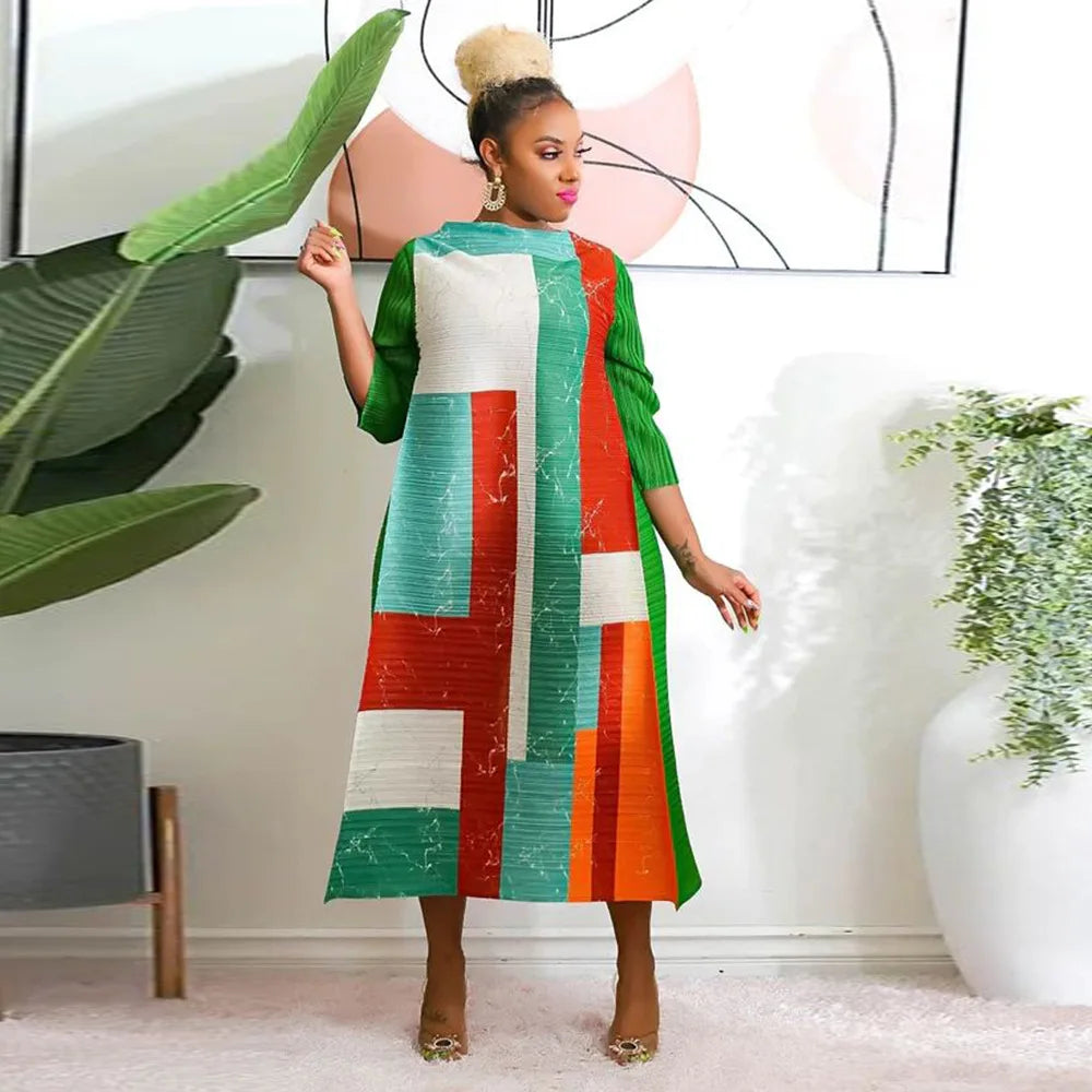 Luxurious African Plus Size Pleated Long Dress, perfect for special occasions, featuring a flattering silhouette and exquisite fabric.