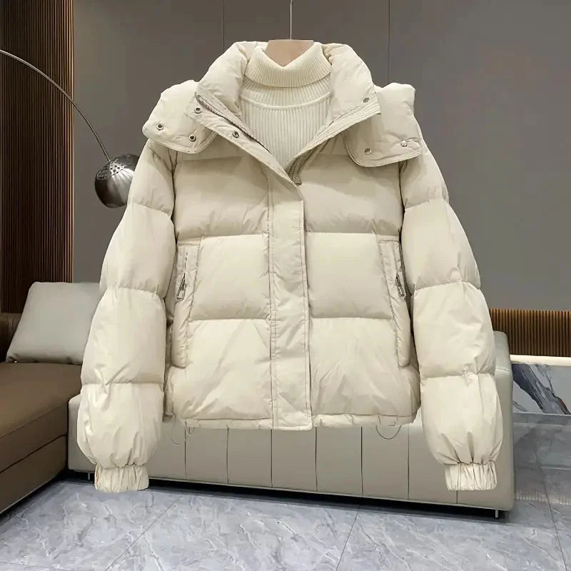 Luxurious women's hooded padded parka jacket featuring thick down cotton for ultimate warmth in autumn and winter streetwear.