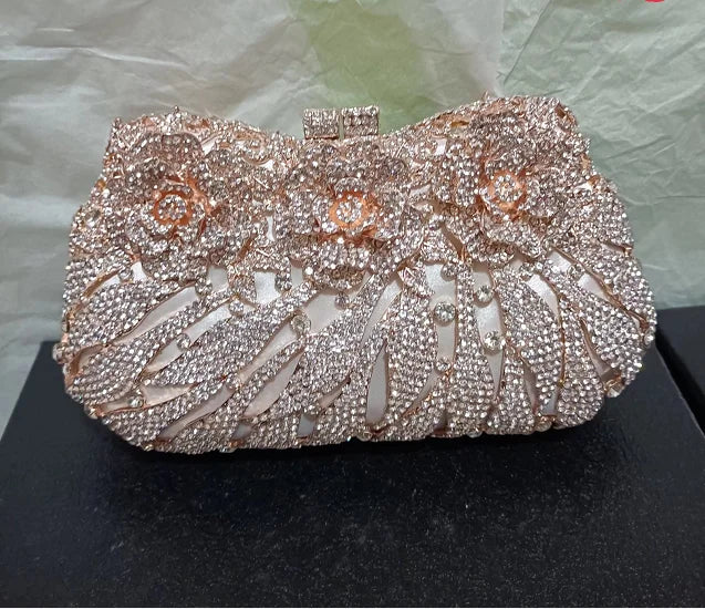 Elegant luxury women's rhinestone evening clutch bag in metallic design, perfect for parties and formal events.