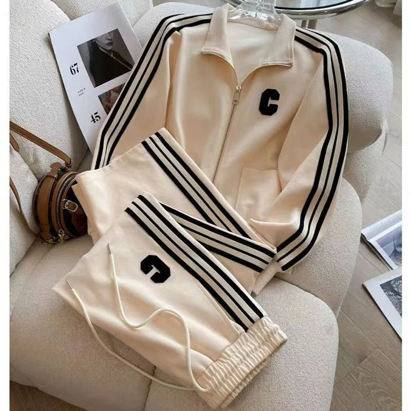 Flat lay of the luxurious embroidered coat and wide leg pants, representing the stylish autumn winter leisure set for women.