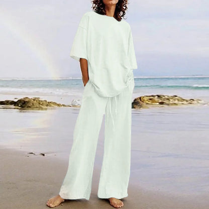 Luxury fashion women's casual 2-piece set featuring a loose lace-up O-neck top and wide leg pants with pockets, ideal for summer style.