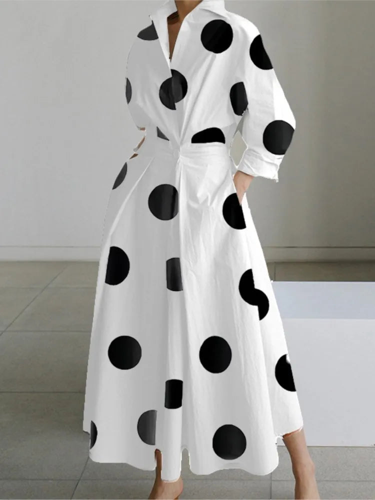 Elegant women's maxi dress with long sleeves, V-neck and chic dot print, perfect for parties.