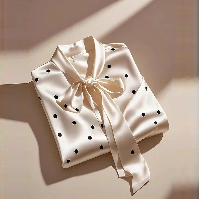 Luxurious satin blouse for women featuring elegant polka dot print, lace-up bow detail, and long sleeves, perfect for a chic office look.