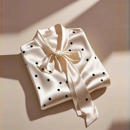 Luxurious satin blouse for women featuring elegant polka dot print, lace-up bow detail, and long sleeves, perfect for a chic office look.