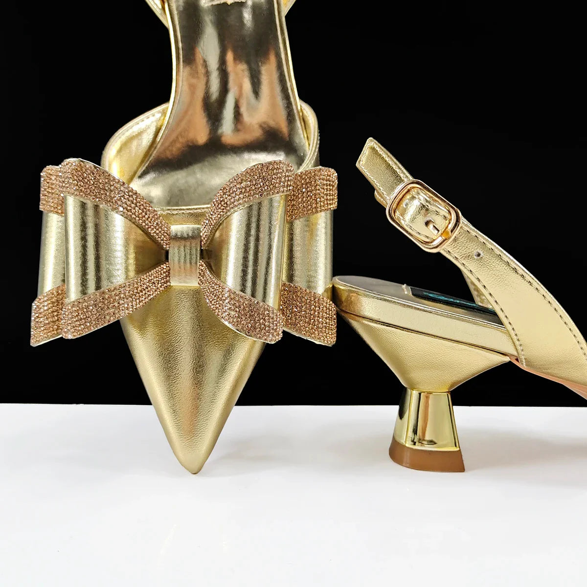 Close-up of luxurious pointed toe design on elegant women's shoes embellished with rhinestones for a sophisticated look.