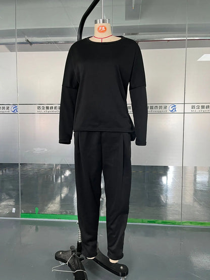 Luxury two piece women's set made from soft cotton linen, showcasing a refined design with a classic O-neckline and elegant straight fit.