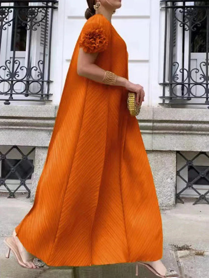 Elegant pleated maxi dress featuring petal sleeves and a half turtleneck, designed for sophisticated women’s formal wear.