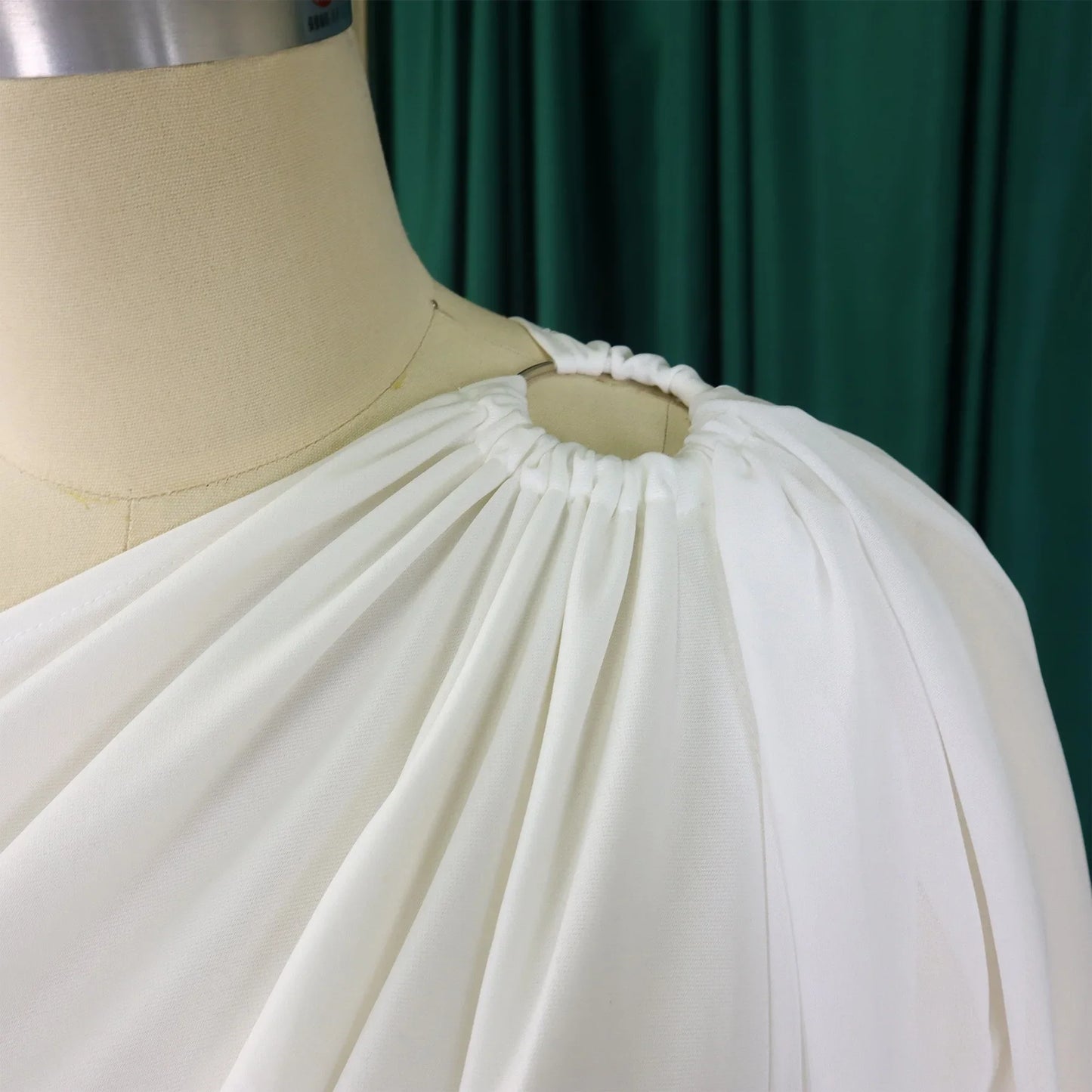 Luxury women's romper with hollow-out decoration and solid pattern, perfect for all season wear.